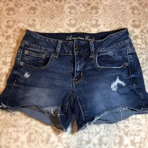 American Eagle distressed blue jean shorts.